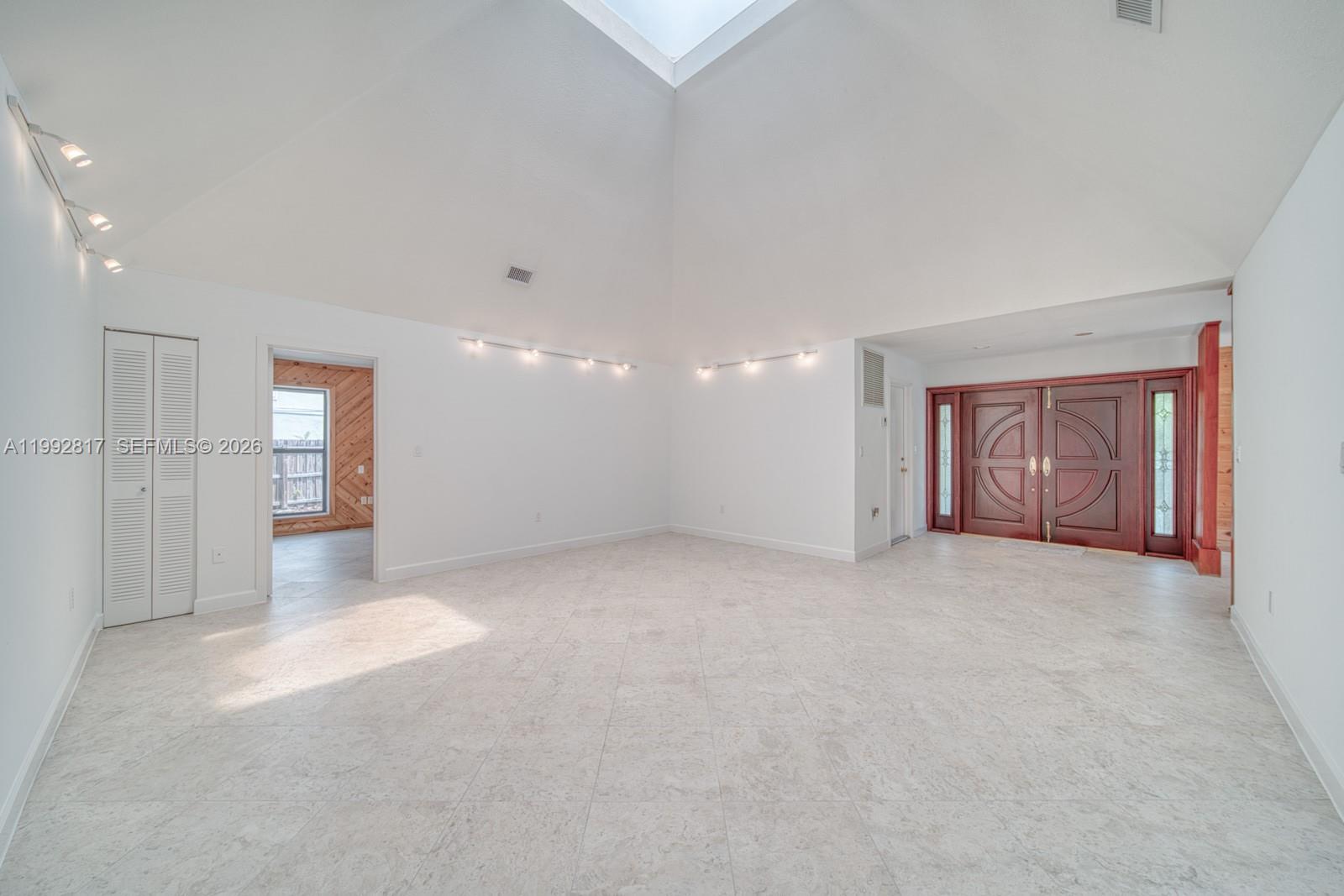 7320 Southwest 100th Court Miami, FL 33173 - Photo 2 of 36 a view of an empty room with a window