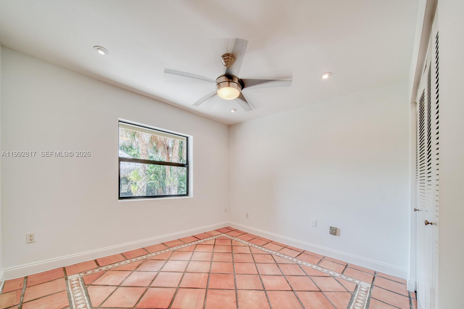 7320 Southwest 100th Court Miami, FL 33173 - Photo 21 of 36 a view of an empty room and window