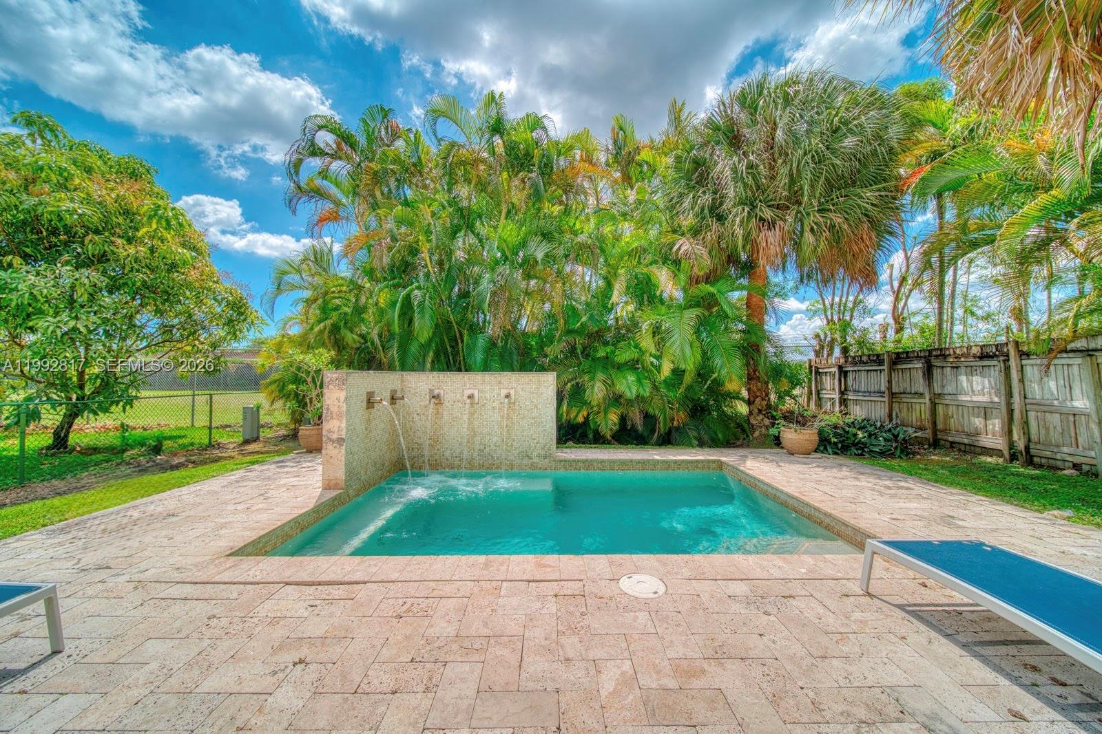 7320 Southwest 100th Court Miami, FL 33173 - Photo 26 of 36 a view of a backyard with green space