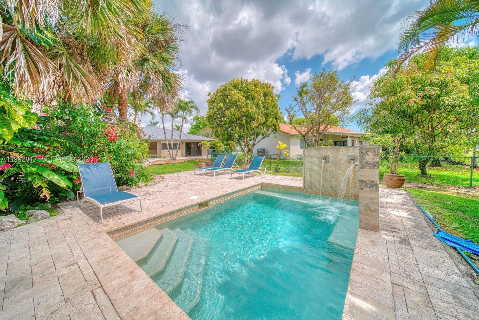 7320 Southwest 100th Court Miami, FL 33173 - Photo 27 of 36 a view of yard with fountain and trees