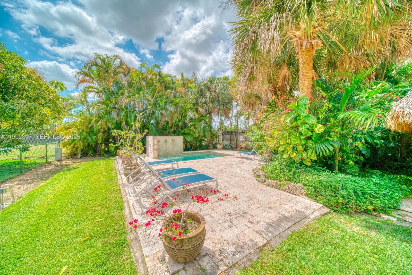 7320 Southwest 100th Court Miami, FL 33173 - Photo 28 of 36 a view of a backyard with fountain
