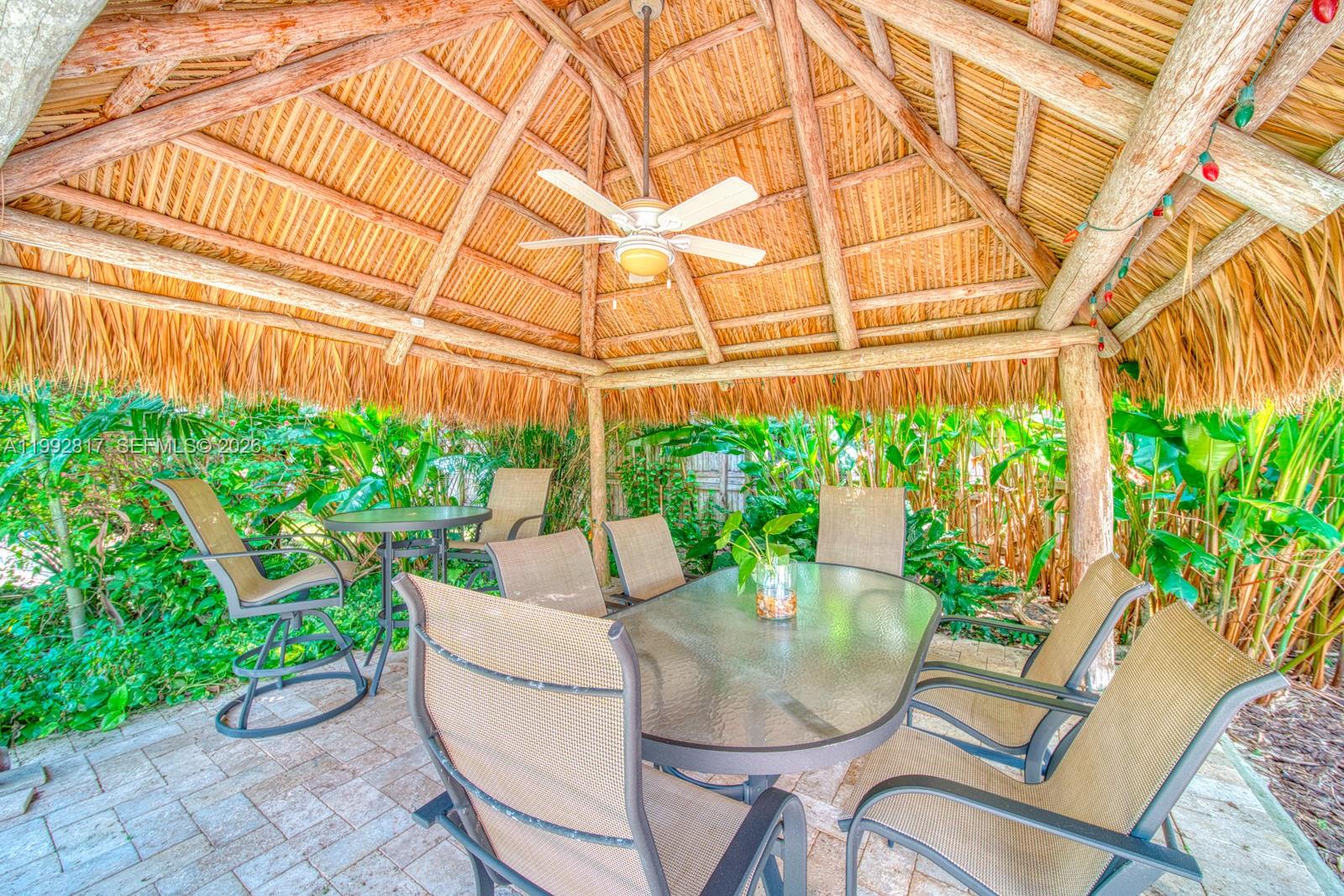 7320 Southwest 100th Court Miami, FL 33173 - Photo 29 of 36 a patio with yard and outdoor seating