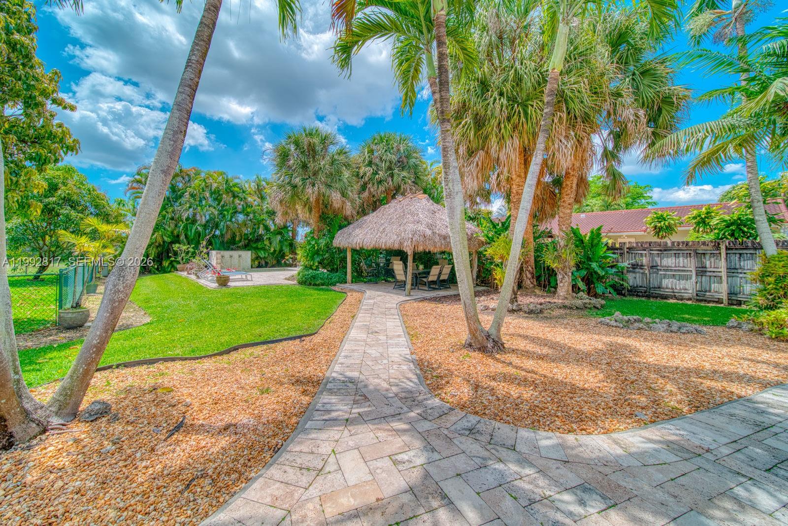 7320 Southwest 100th Court Miami, FL 33173 - Photo 30 of 36 a view of a park with a slide and a tree