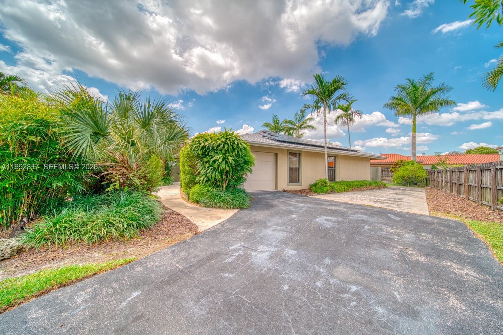 7320 Southwest 100th Court Miami, FL 33173 - Photo 33 of 36 a view of a house with palm trees