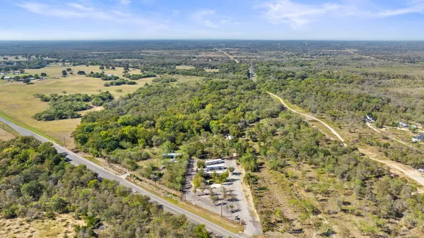 an aerial view of a residential houses with an outdoor space