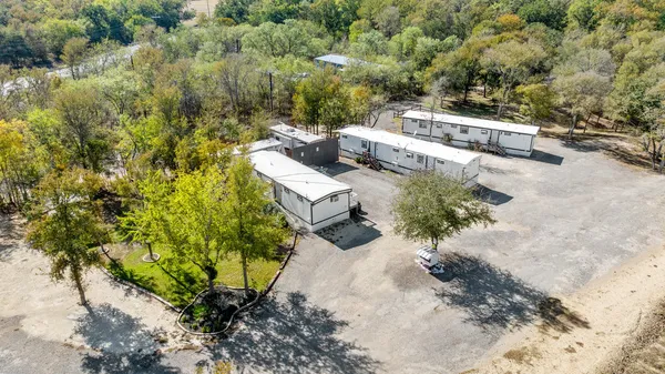 an aerial view of a house with a yard