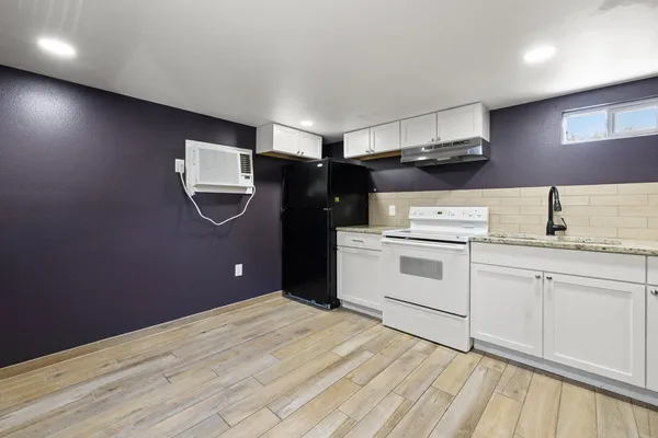 a kitchen with a sink stainless steel appliances and cabinets