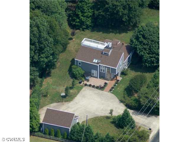 1300 Cardwell Road Crozier, VA 23039 - Photo 1 of 12 Aerial View - Unique home! Home has evolved around the original log cabin - now the kitchen. 1st & 2nd floor masters, 2 stone fireplaces, rooftop widow's walk, detached 2-car garage, vinyl siding, dimensional roof, 3 hot water heaters, all bedrooms have walk-in closets