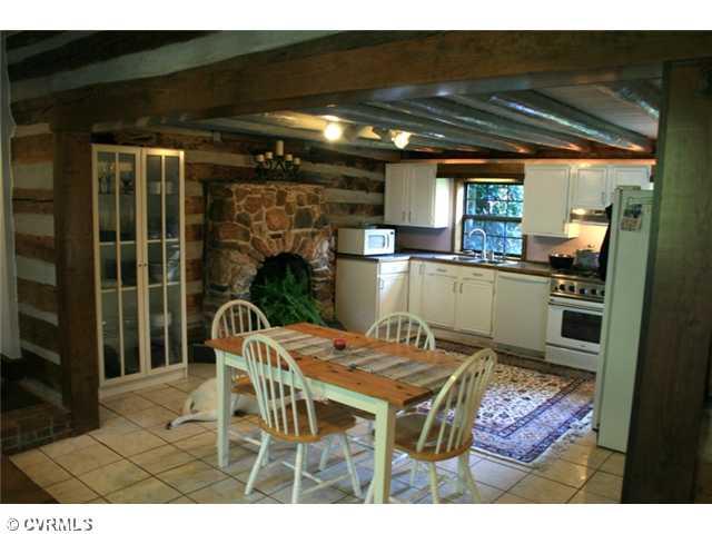 1300 Cardwell Road Crozier, VA 23039 - Photo 4 of 12 Kitchen - Original portion of home, circa 1800, a slave's log cabin. Now has tiled floor, walk-in pantry, 5-burner gas range, & Bosch dishwasher.