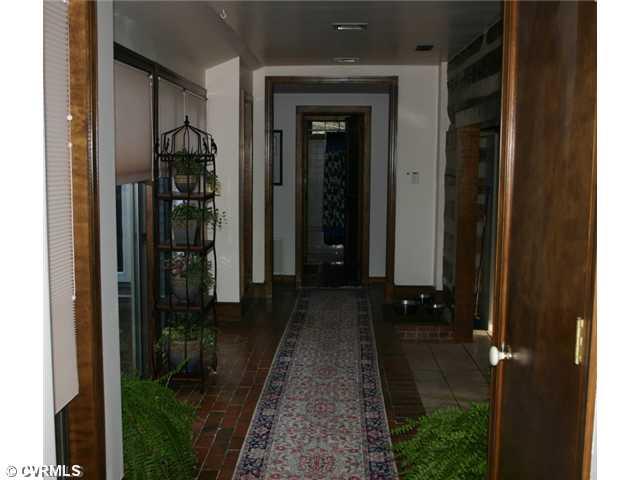 1300 Cardwell Road Crozier, VA 23039 - Photo 8 of 12 Other - Brick walkway by kitchen with 2 sets of sliding doors to patio w/hot tub.