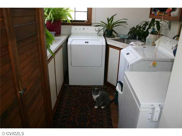 1300 Cardwell Road Crozier, VA 23039 - Photo 9 of 12 Laundry - Brick floor, cabinets & sink.