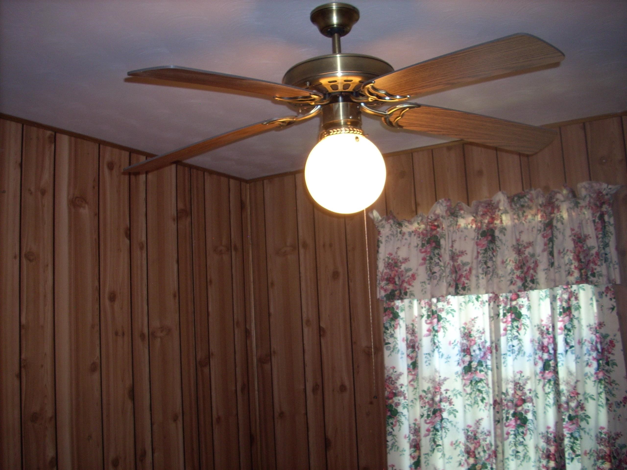 4282 Westmont Road Memphis, TN 38109 - Photo 8 of 15 Ceiling fan with brass-tone hardware and wood-finish blades