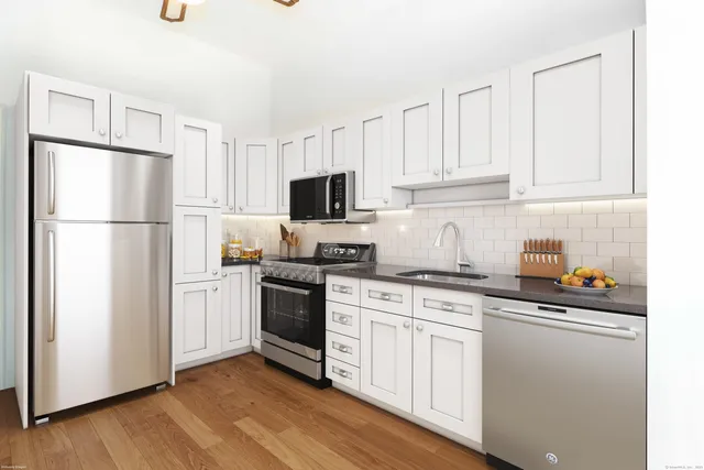 a view of a room with cabinet mirror and windows