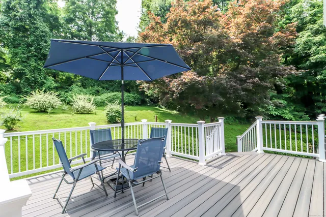 a bathroom with a sink mirror vanity and toilet