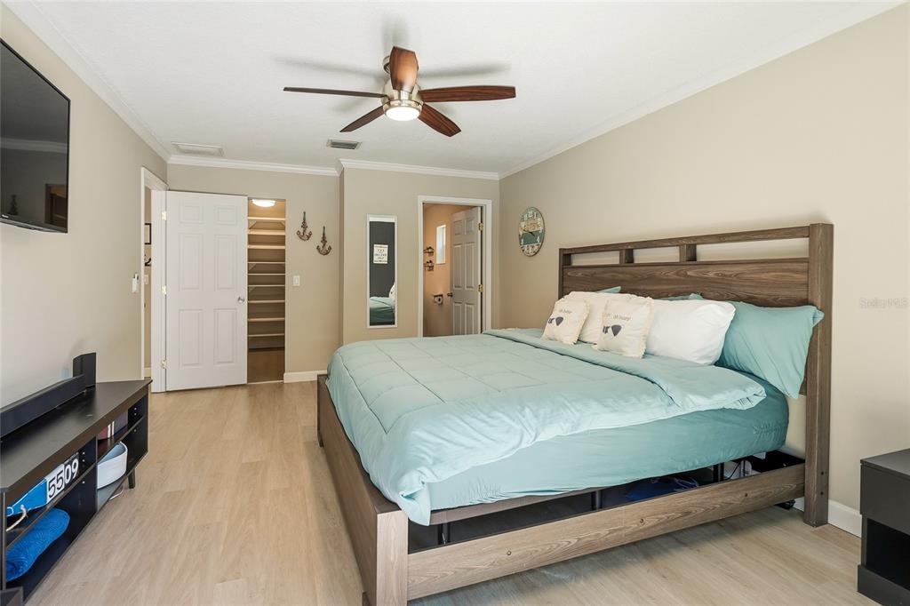 4606 Buckeye Road Tampa, FL 33624 - Photo 26 of 39 a bed sitting in a bedroom and a flat tv screen