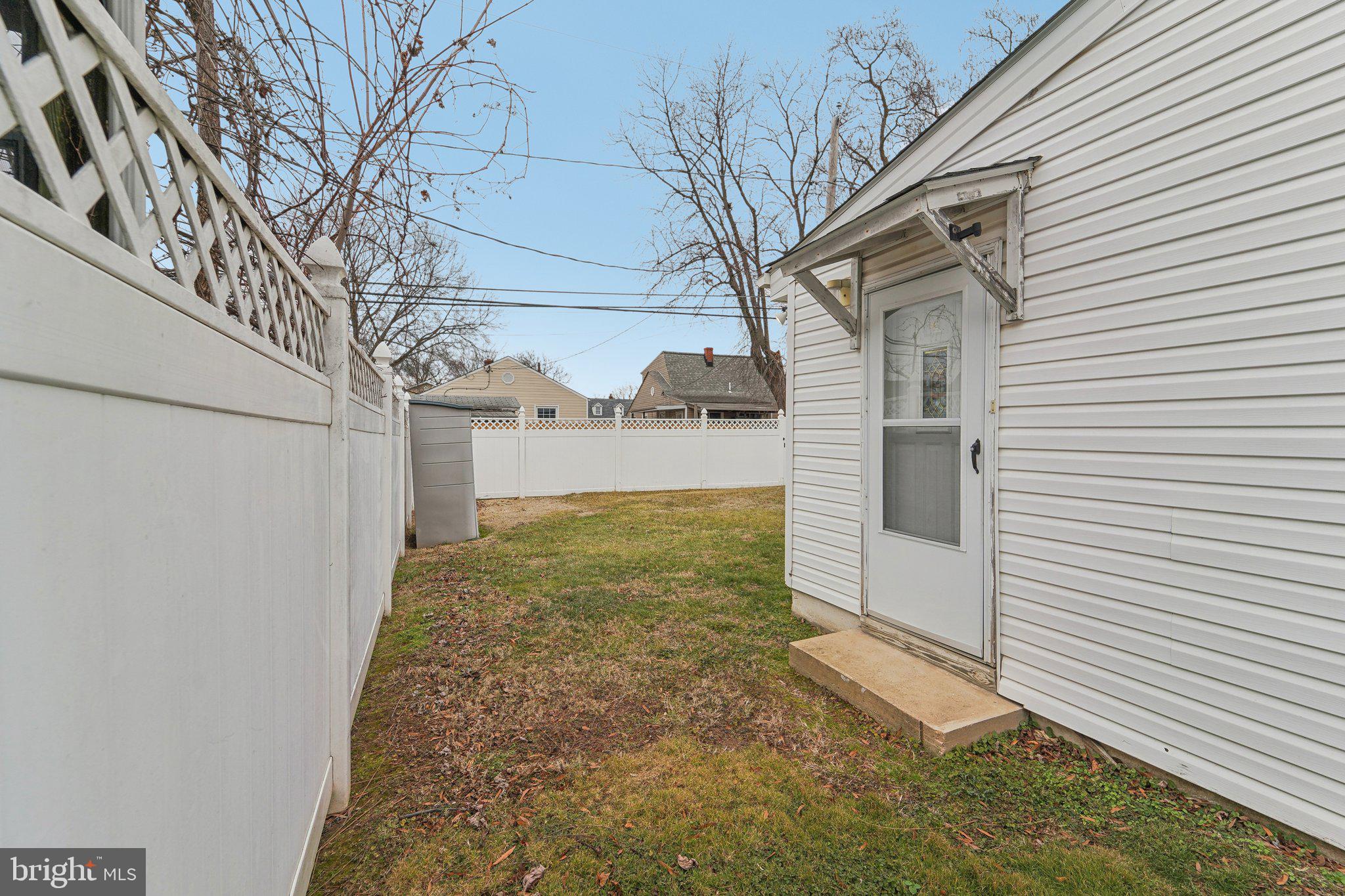 8218 Longpoint Road Dundalk, MD 21222 - Photo 20 of 30 a view of a yard with wooden fence