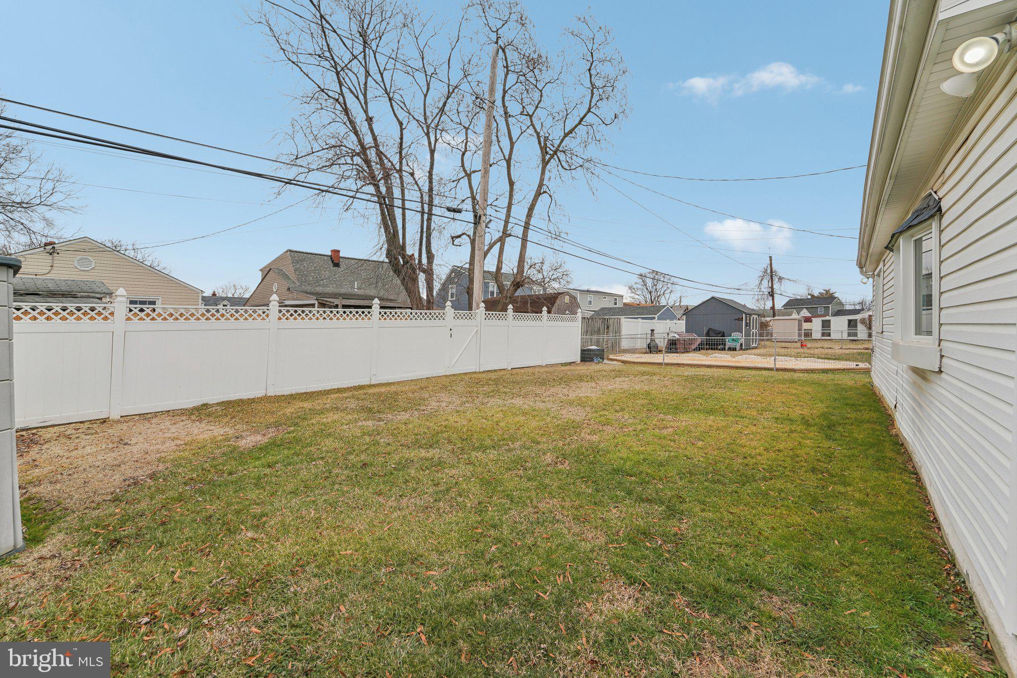 8218 Longpoint Road Dundalk, MD 21222 - Photo 21 of 30 a view of a yard with yellow house