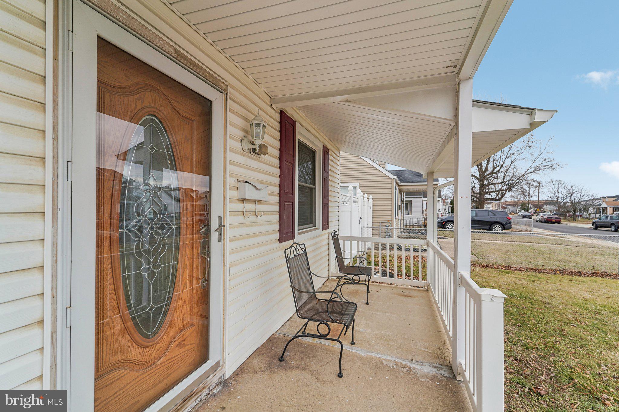 8218 Longpoint Road Dundalk, MD 21222 - Photo 3 of 30 a view of balcony with two chairs