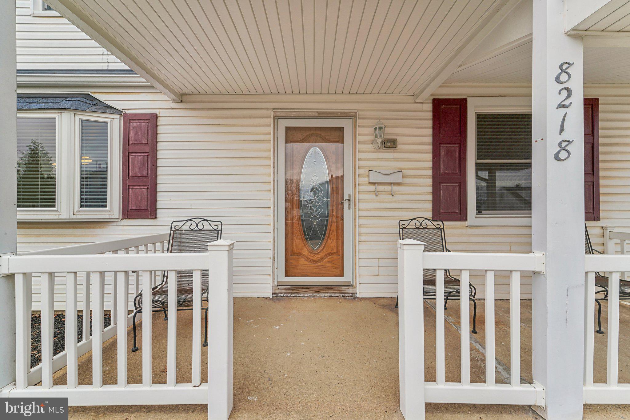8218 Longpoint Road Dundalk, MD 21222 - Photo 4 of 30 a front view of a house with a porch