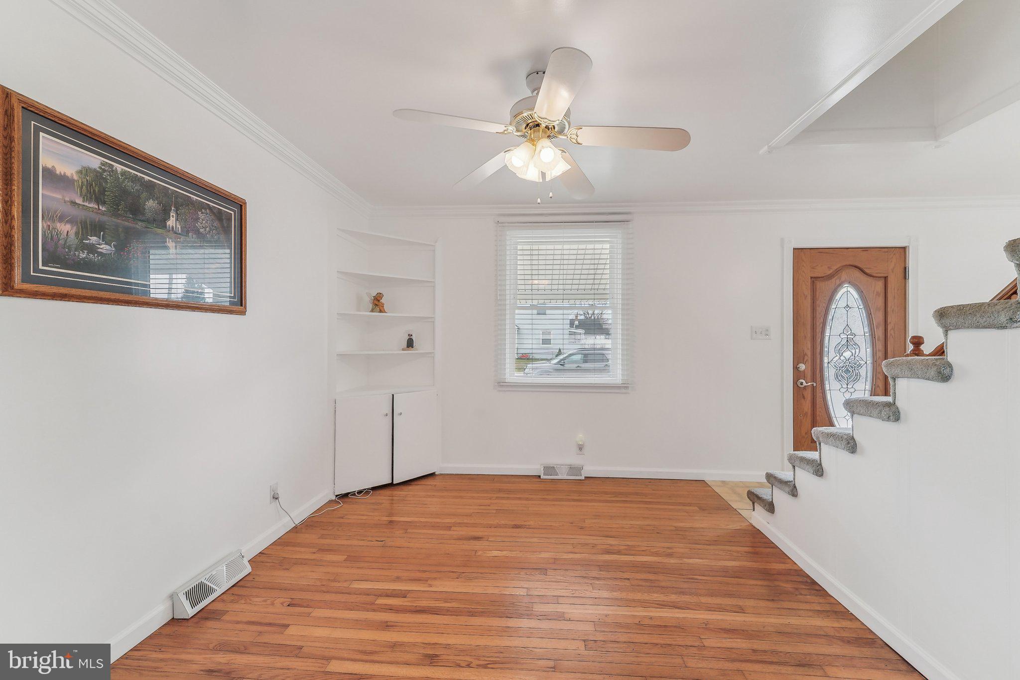 8218 Longpoint Road Dundalk, MD 21222 - Photo 7 of 30 a bedroom with a bed and a chandelier