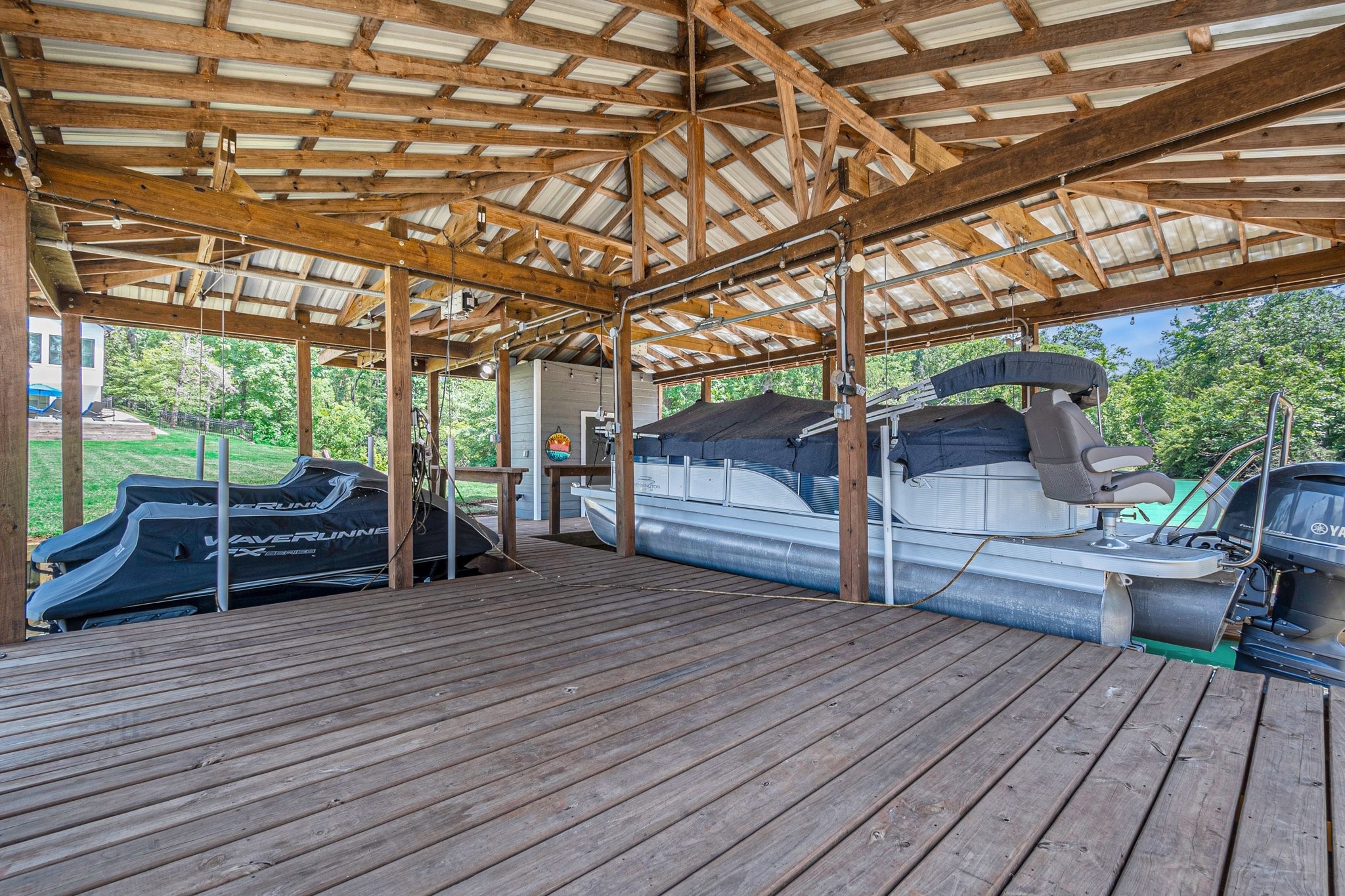 111 Seagull Path Point Blank, TX 77364 - Photo 43 of 49 Boat dock with party area and storage closet.