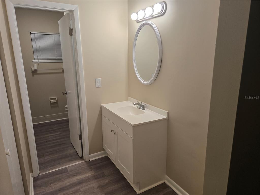 10040 Southwest 98th Avenue Ocala, FL 34481 - Photo 18 of 28 a bathroom with a sink a mirror and a shower