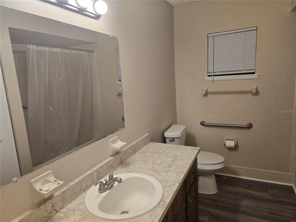 10040 Southwest 98th Avenue Ocala, FL 34481 - Photo 22 of 28 a bathroom with a sink and a toilet