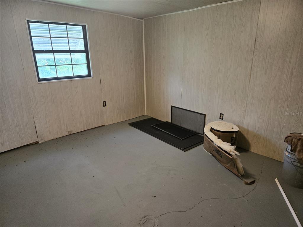 10040 Southwest 98th Avenue Ocala, FL 34481 - Photo 24 of 28 an empty room with windows