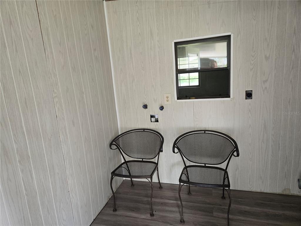 10040 Southwest 98th Avenue Ocala, FL 34481 - Photo 26 of 28 a dining room with furniture and wooden floor