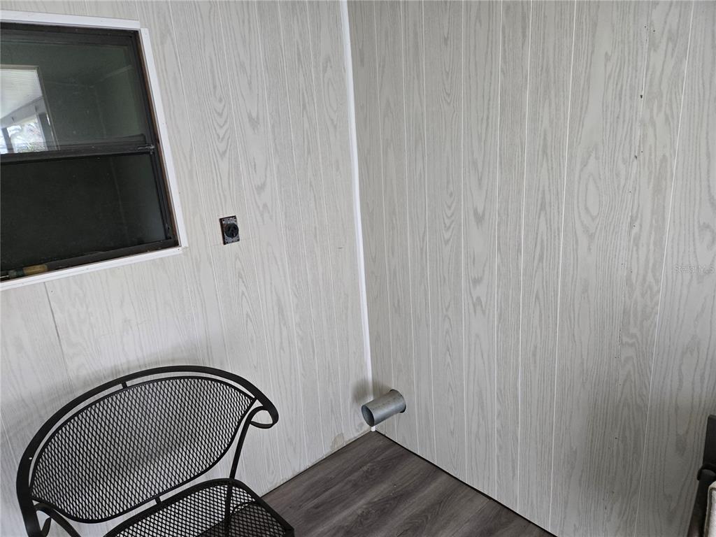 10040 Southwest 98th Avenue Ocala, FL 34481 - Photo 27 of 28 a bathroom with a shower curtain and a mirror