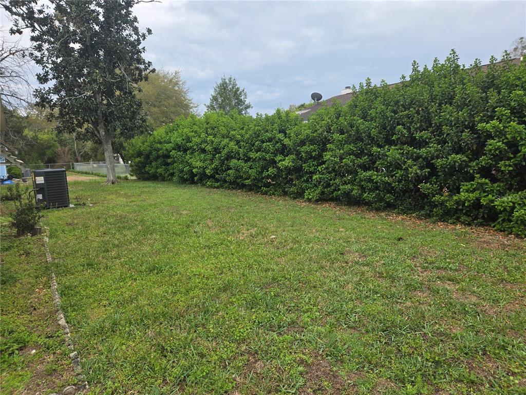 10040 Southwest 98th Avenue Ocala, FL 34481 - Photo 8 of 28 a view of a field of grass and trees