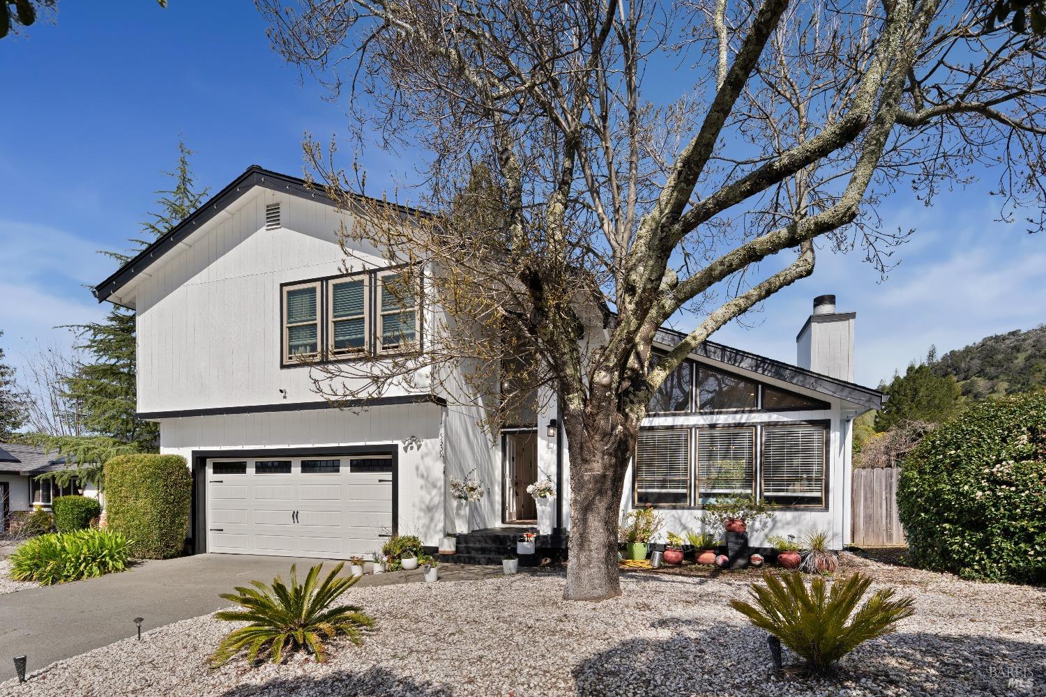 5339 Yerba Buena Road Santa Rosa, CA 95409 - Photo 1 of 1 a front view of a house with a yard