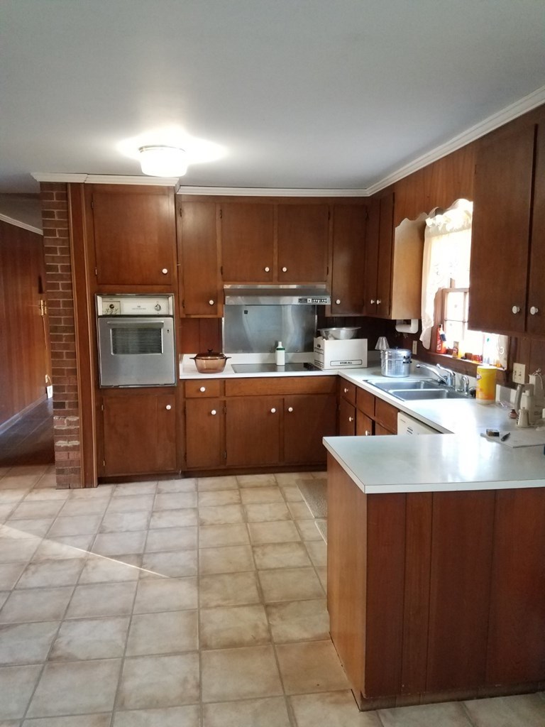 174 Hampton Hills Road Gray, GA 31032 - Photo 2 of 31 a kitchen with a sink a counter top space cabinets and stainless steel appliances