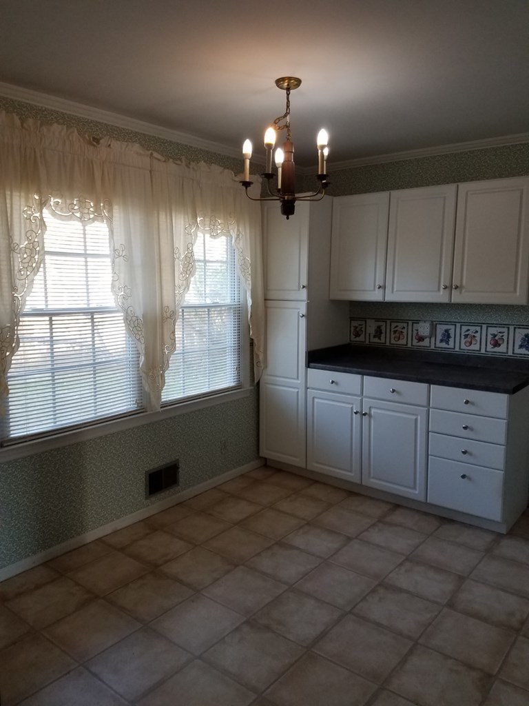 174 Hampton Hills Road Gray, GA 31032 - Photo 5 of 31 a view of kitchen with window and cabinets