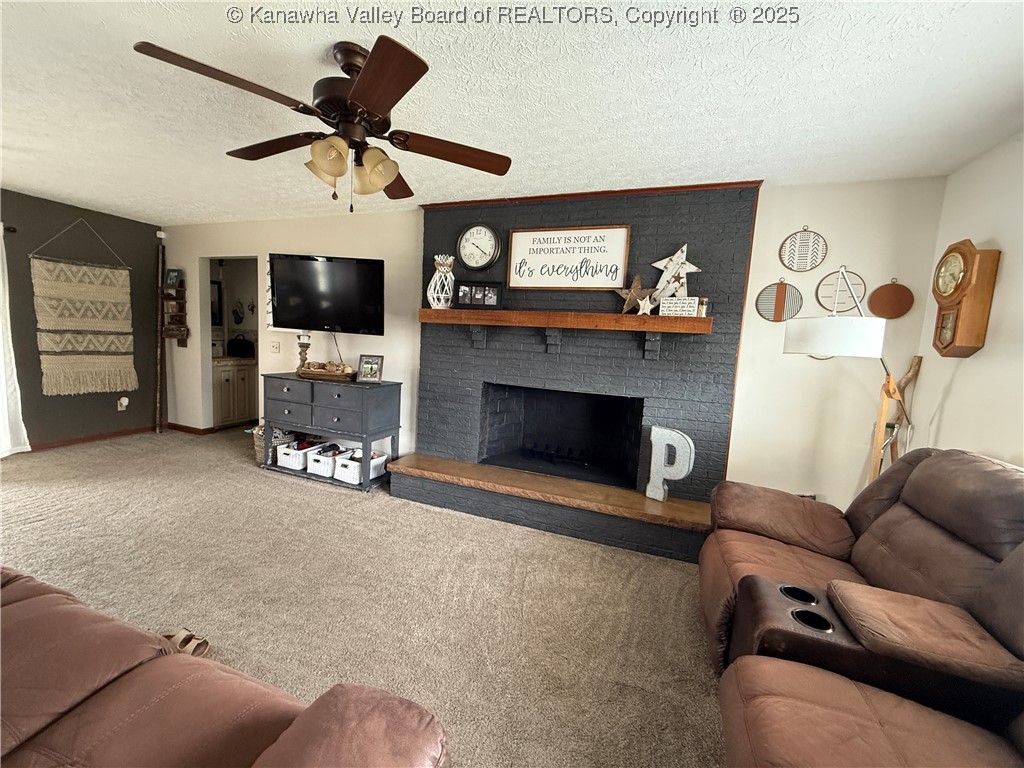 living room with wood burning fireplace