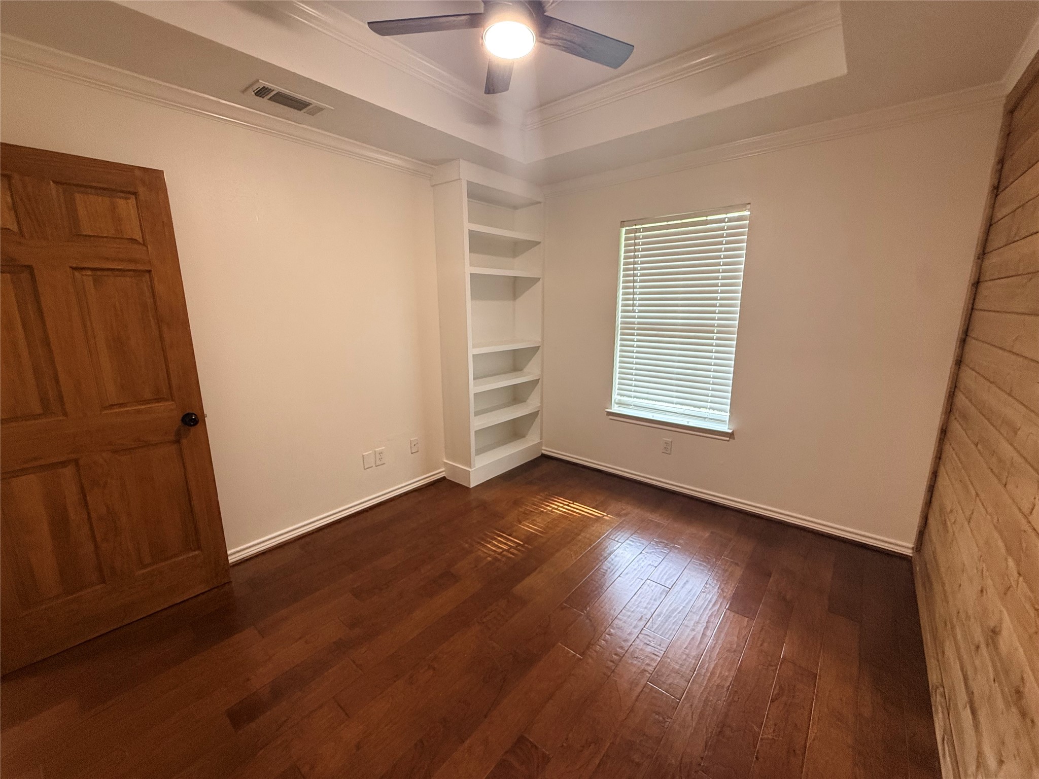 855 County Road 2267 Cleveland, TX 77327 - Photo 15 of 24 an empty room with wooden floor cabinet and windows