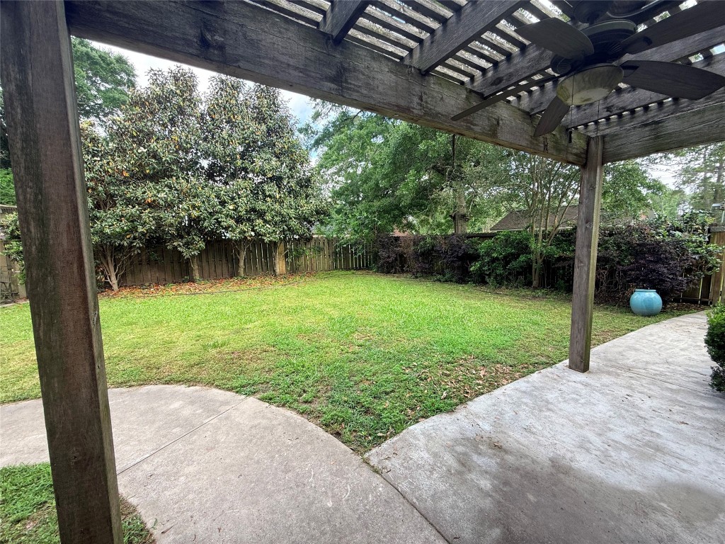 855 County Road 2267 Cleveland, TX 77327 - Photo 23 of 24 a view of a porch with a backyard