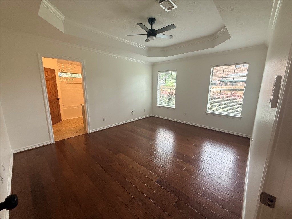 855 County Road 2267 Cleveland, TX 77327 - Photo 6 of 24 a view of an empty room with wooden floor and a window