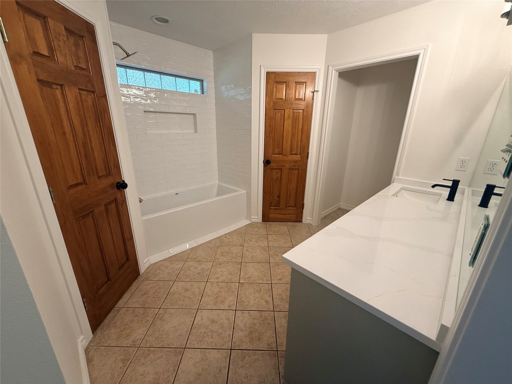 855 County Road 2267 Cleveland, TX 77327 - Photo 8 of 24 a bathroom with a sink a toilet and a shower
