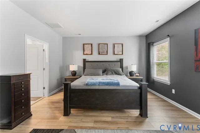 a bedroom with a bed and a fireplace