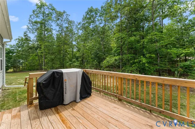 a view of balcony with wooden floor and fence