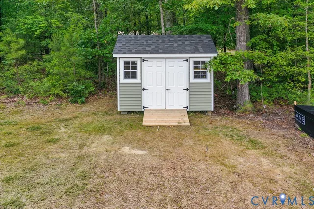 a house view with a backyard space
