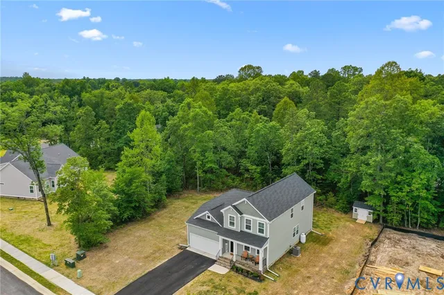 a view of a two chairs in a backyard