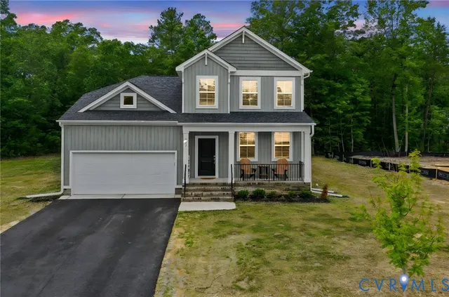 a front view of a house with yard