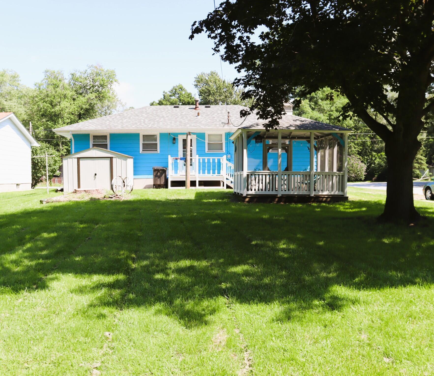 2698 County Line Road Lake Station, IN 46405 - Photo 18 of 22 a front view of a house with a garden and trees