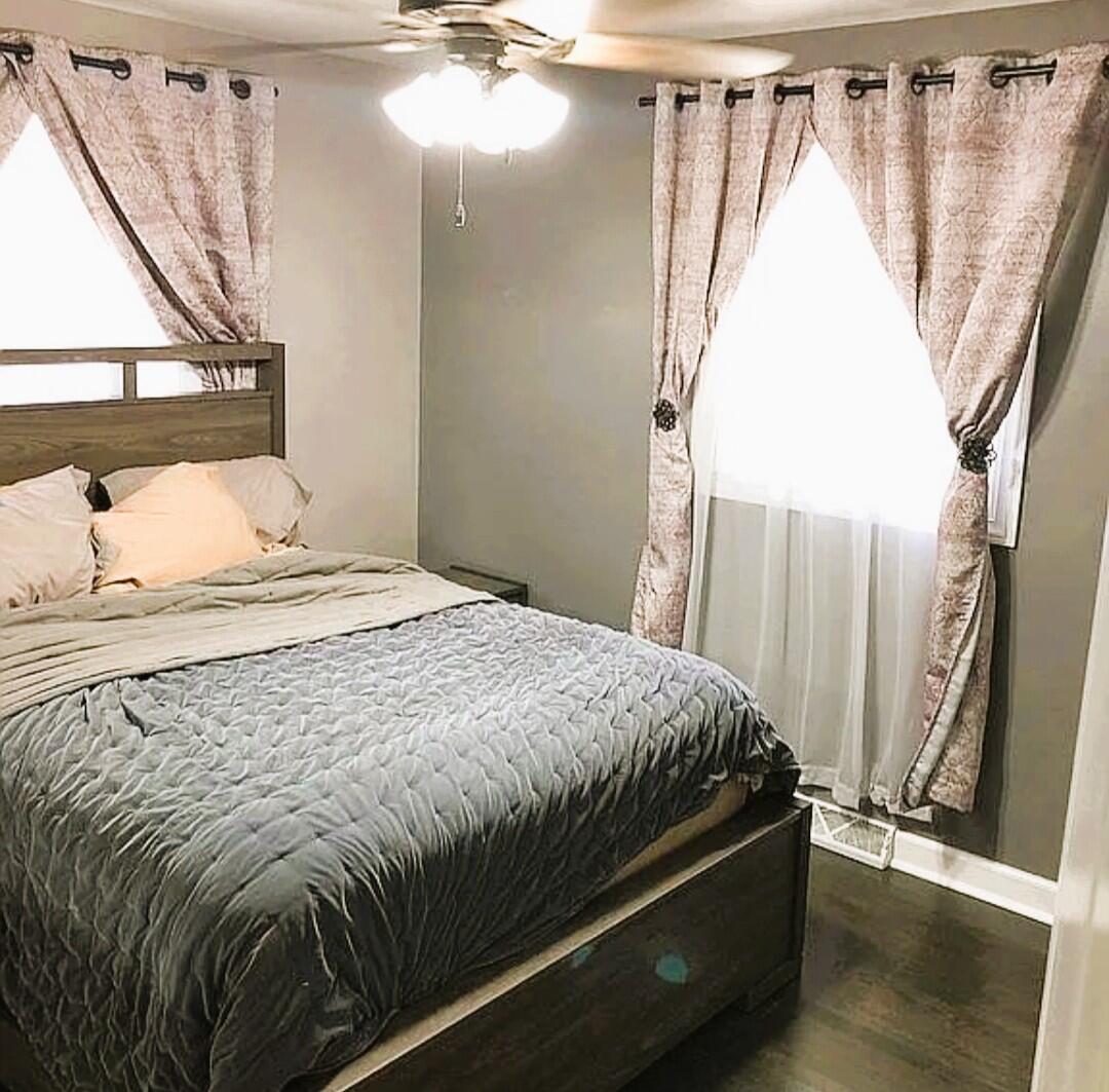2698 County Line Road Lake Station, IN 46405 - Photo 9 of 22 a bed sitting in a bedroom next to a window