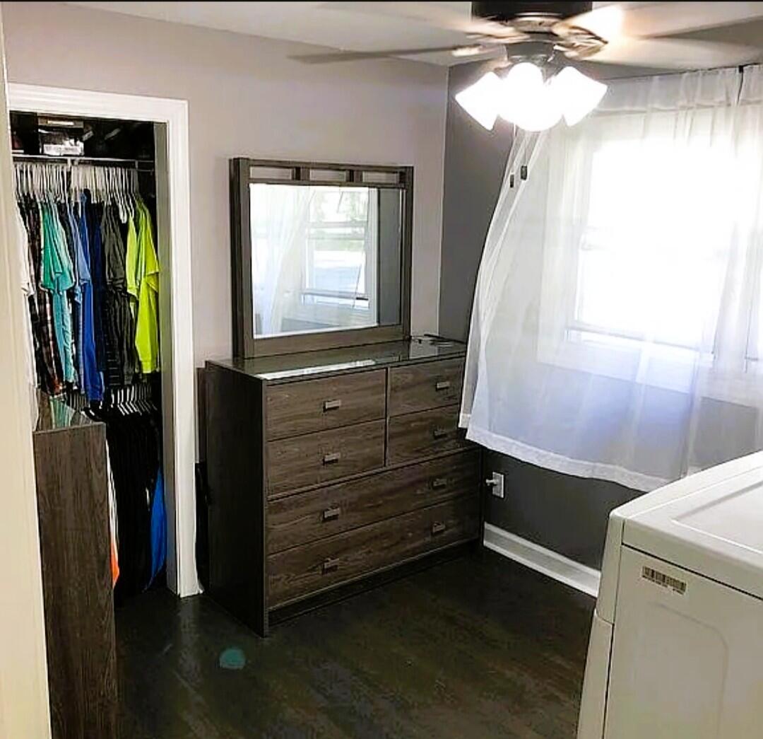 2698 County Line Road Lake Station, IN 46405 - Photo 10 of 22 a view of walk in closet with clothes and shoes