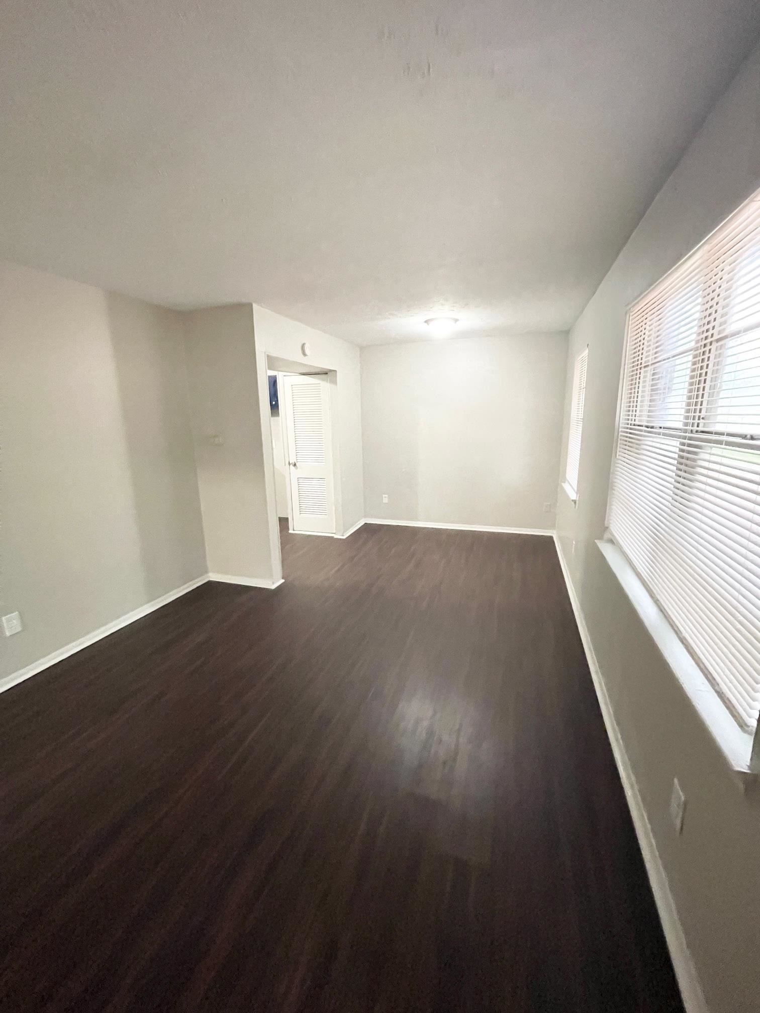 2952 Randy Lane Memphis, TN 38118 - Photo 2 of 11 an empty room with wooden floor and windows