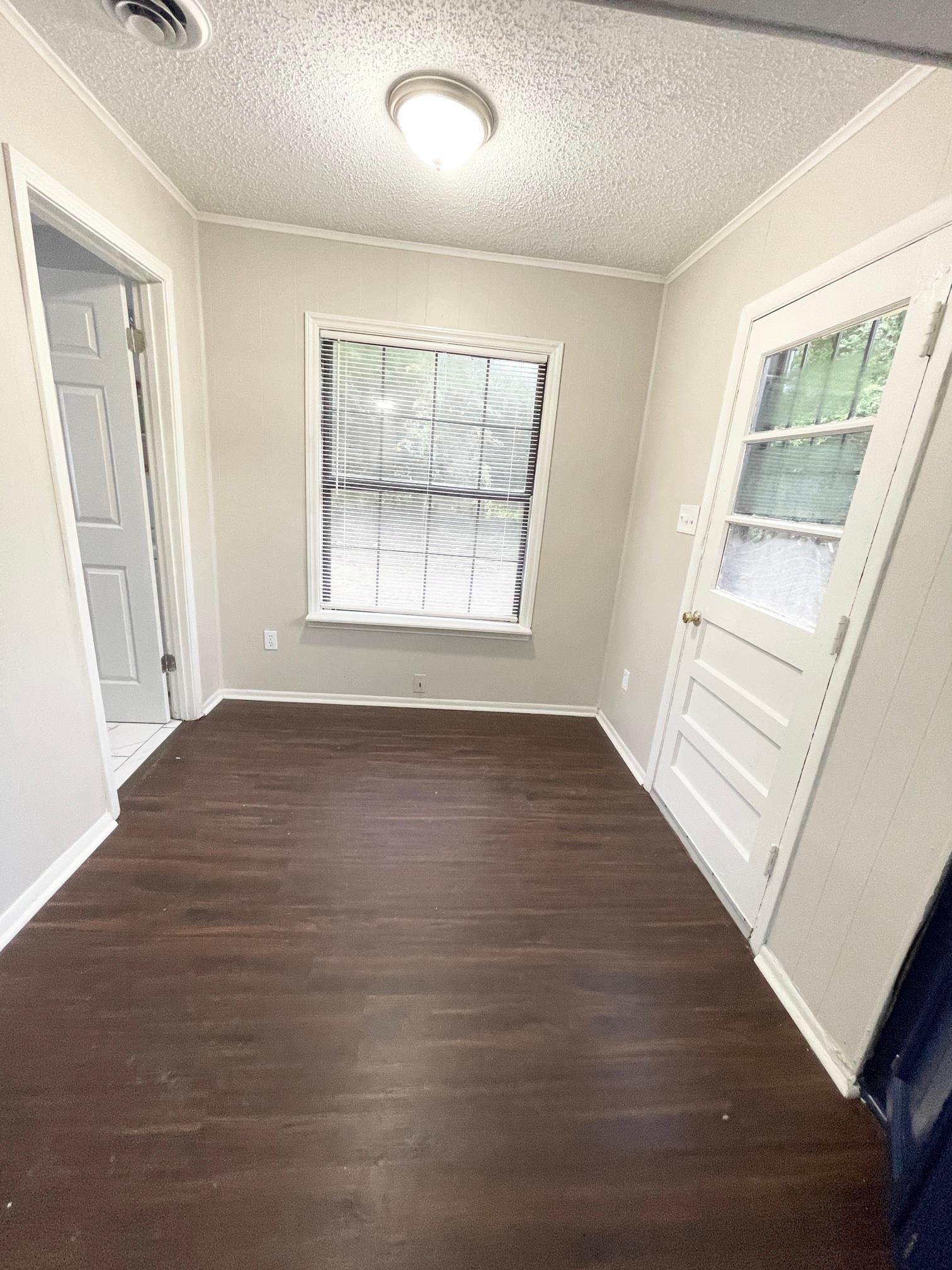 2952 Randy Lane Memphis, TN 38118 - Photo 4 of 11 an empty room with wooden floor and windows