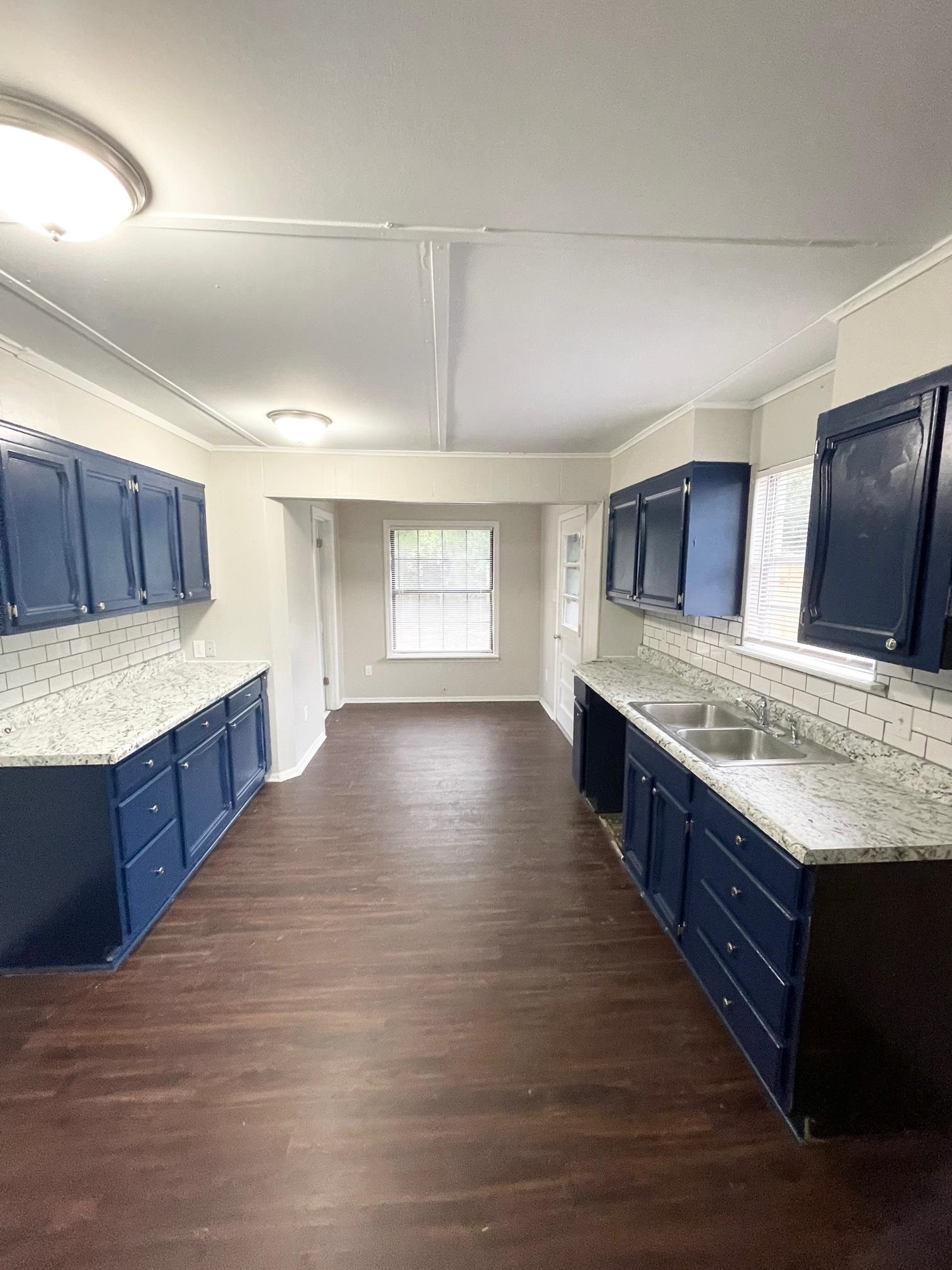 2952 Randy Lane Memphis, TN 38118 - Photo 5 of 11 a large kitchen with wooden floor and cabinets